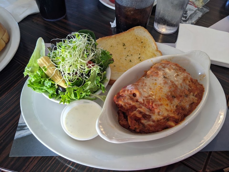 Printed lunch menu for sandwiches and sides.