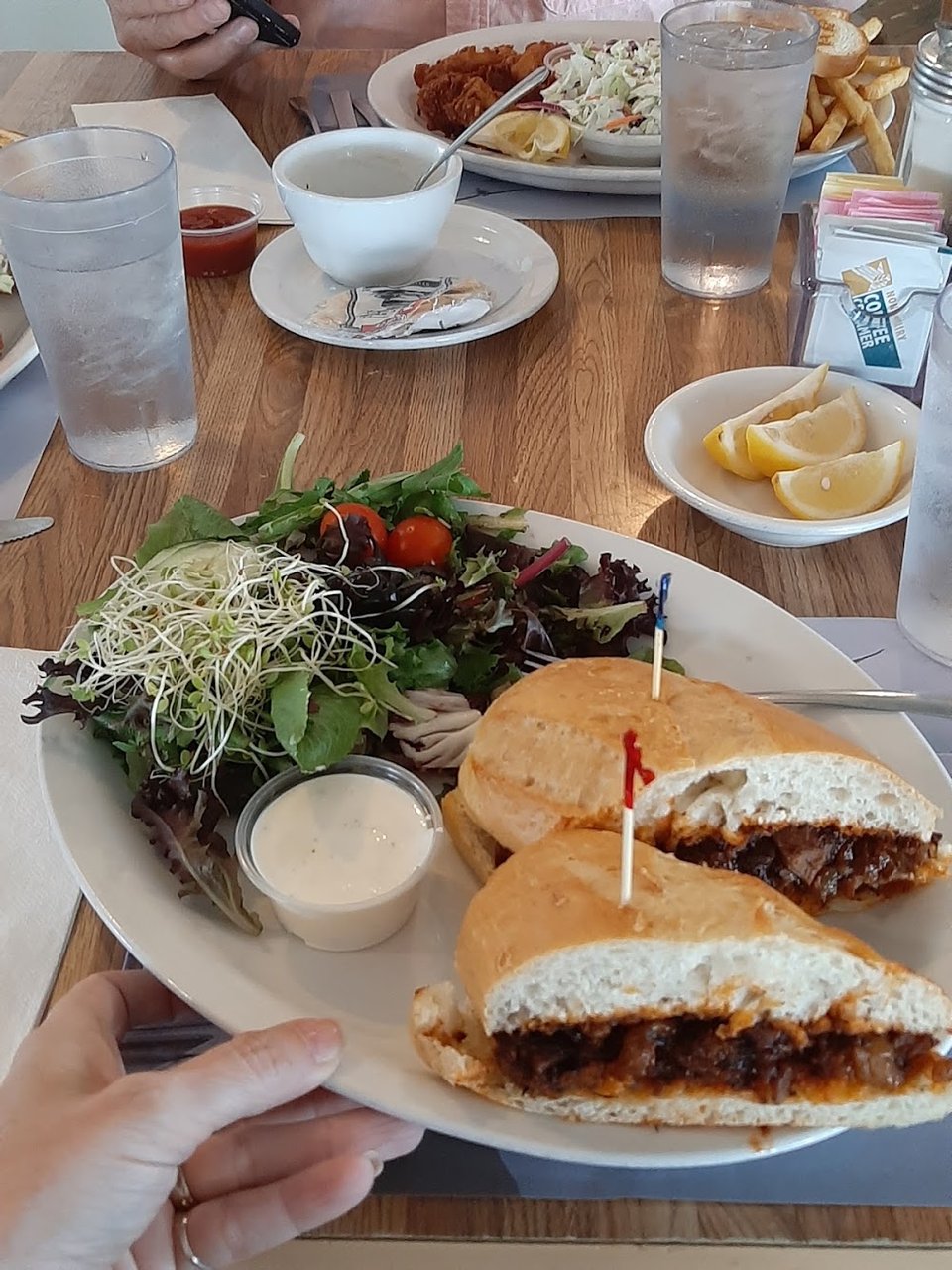 Menu page with seafood sandwiches and beverages.