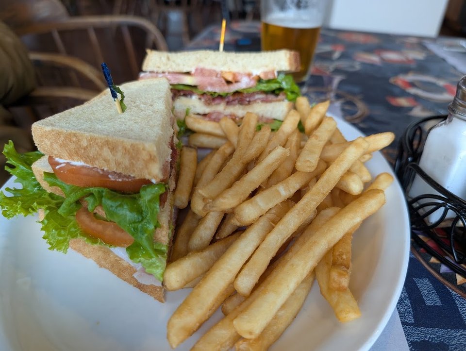 Lunch menu showing hot sandwiches and soft drinks.