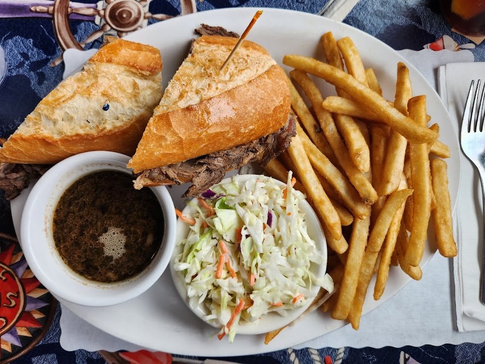 Menu page with seafood sandwiches and beverages.